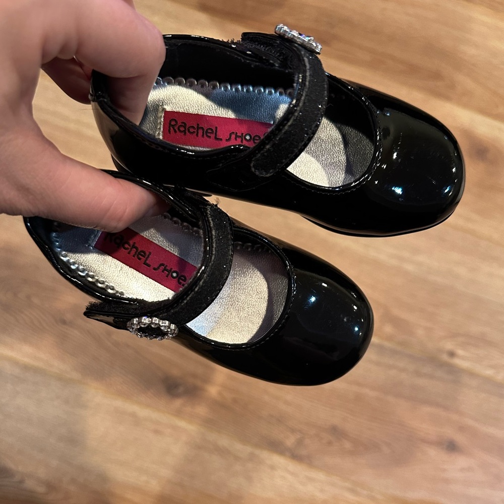 Black patent leather baby Mary Janes.